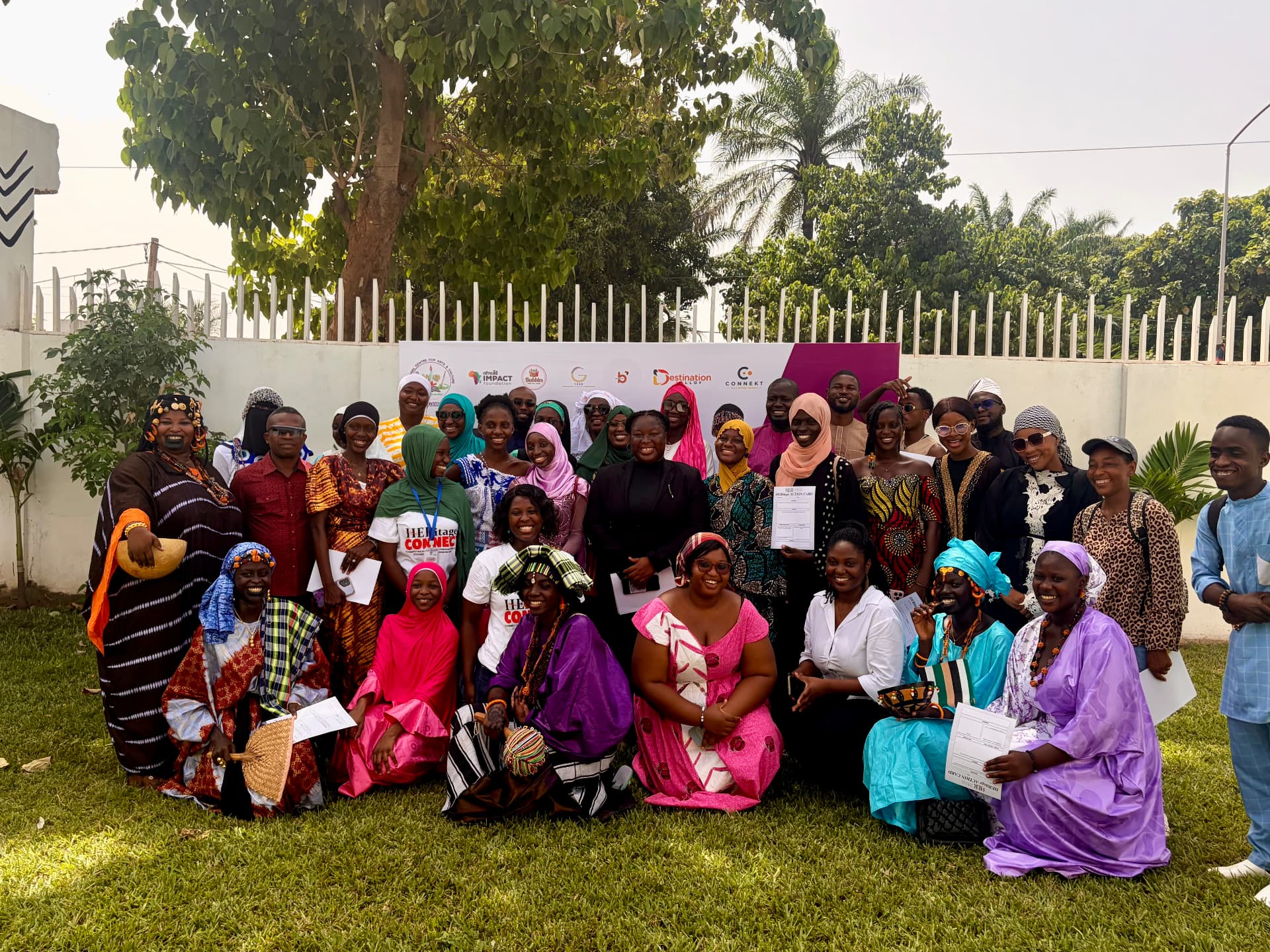HERitage Connect participants and cultural professionals posing together outdoors in The Gambia